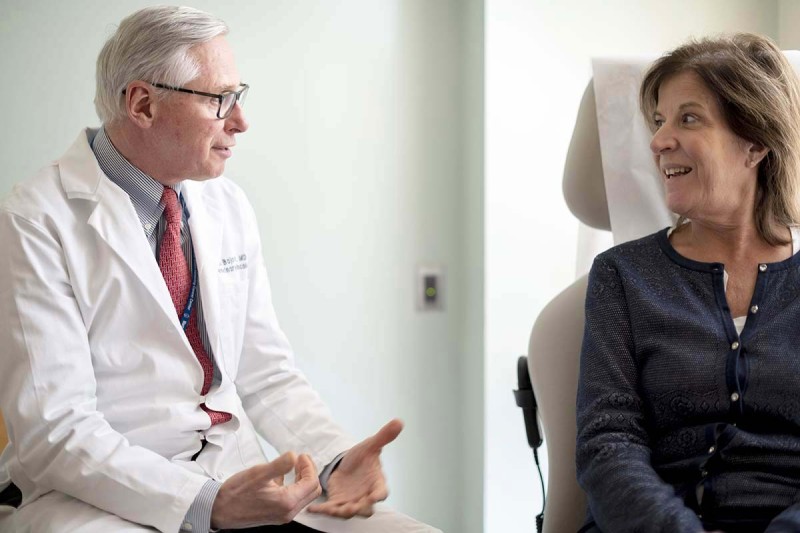 MSK Medical oncologist, Dean Bajorin, speaks with a female patient.
