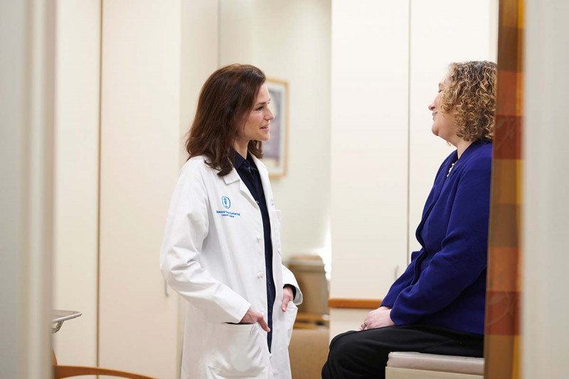 MSK endocrinologist Eliza Geer meets with a patient.