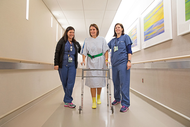 MSK physical therapist Amanda Molnar and occupational therapist Nicole Kasven-Gonzalez aid a patient.