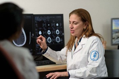 Neurosurgeon Viviane Tabar looks at a brain scan