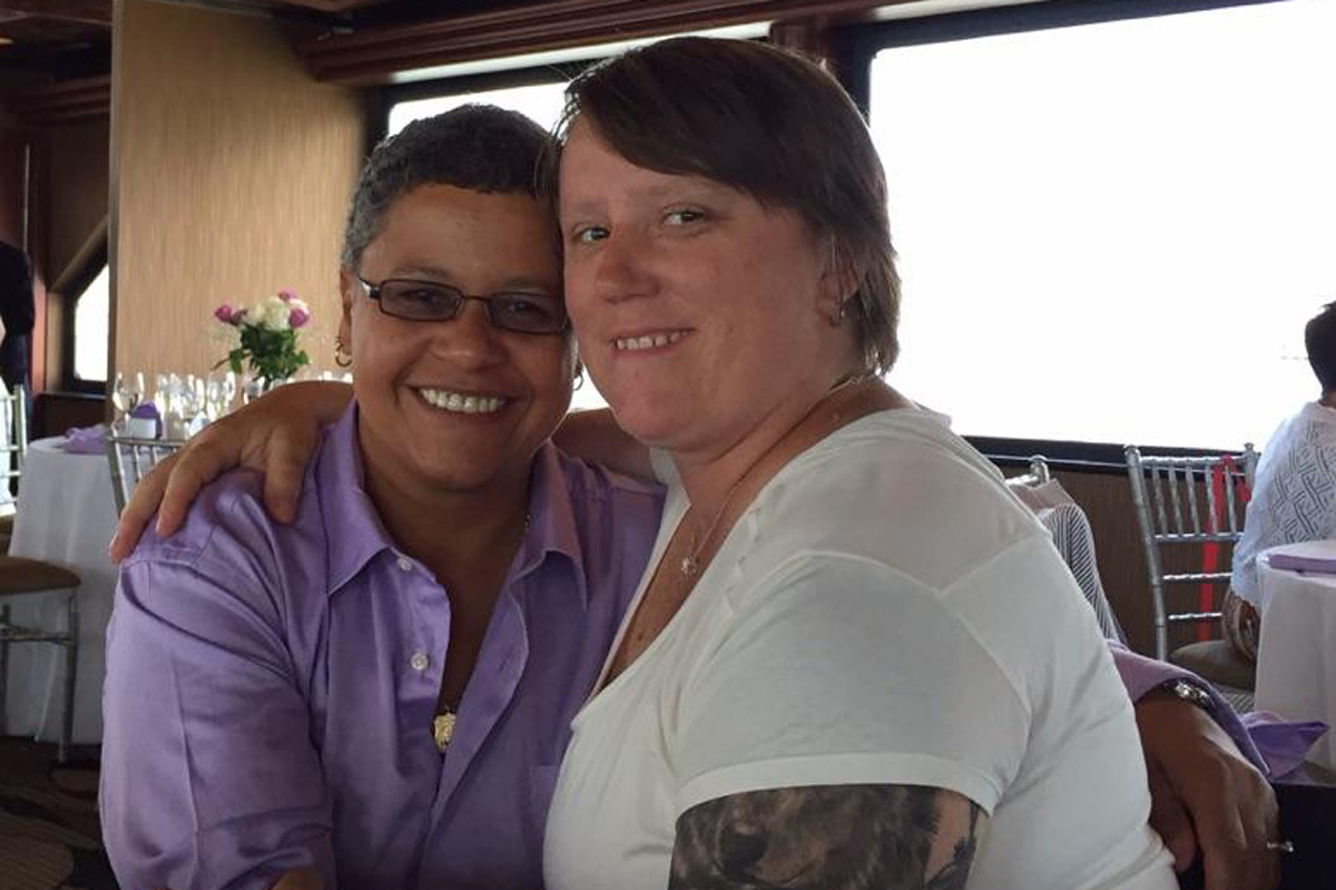 Memorial Sloan Kettering ovarian cancer patient Vilma Rosario and her partner, Michele Freeman, at a restaurant.